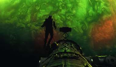 an astronaut floats above a swirling green planet