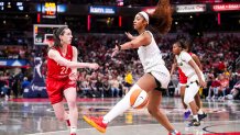 Indiana Fever guard Caitlin Clark (22) passes around Chicago Sky forward Angel Reese (5) on May 17, 2025, during a game between the Indiana Fever and the Chicago Sky at Gainbridge Fieldhouse in Indianapolis. 
