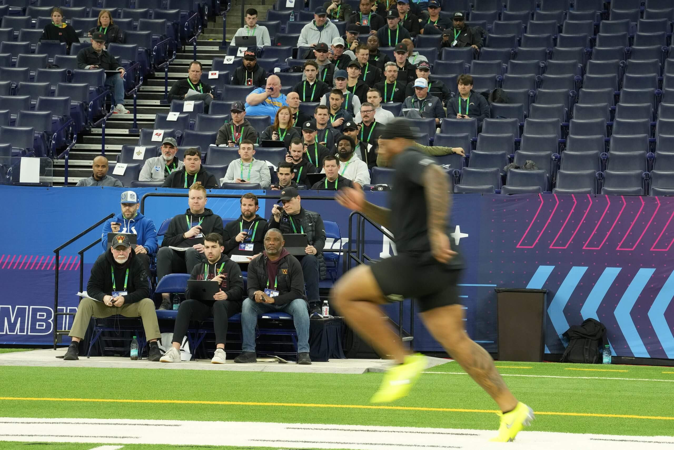 NFL scouts watch testing at the NFL Scouting Combine in Indianapolis.
