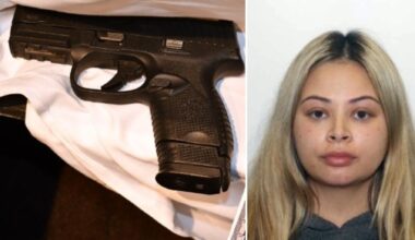 Toronto police vehicle outside a downtown hotel, representing the firearm investigation.