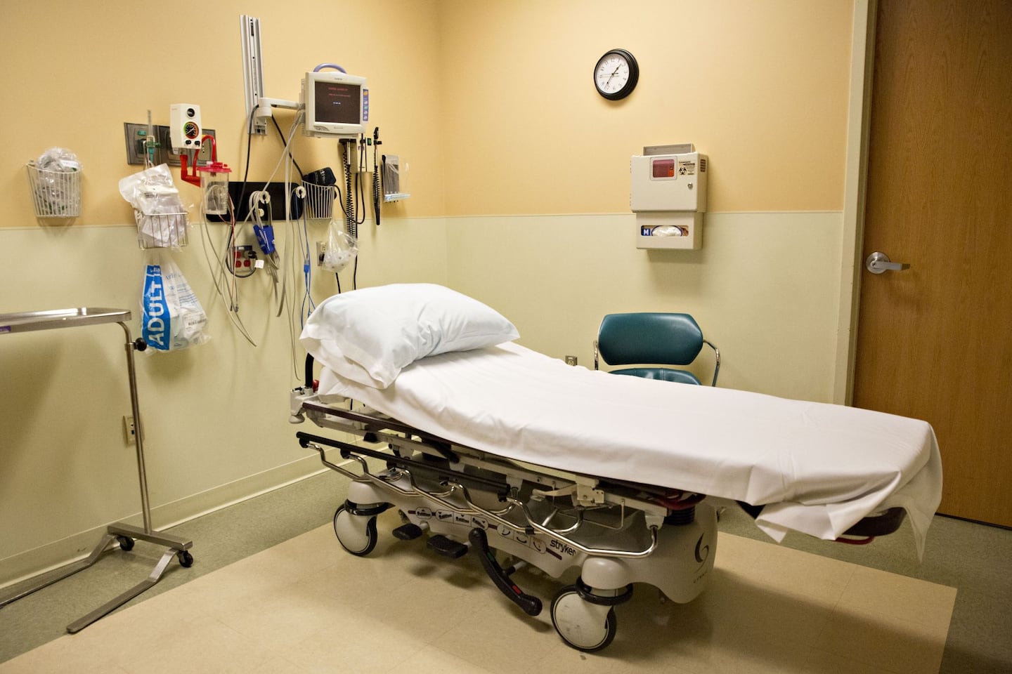 An exam bed sits in a room.