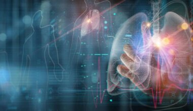 A hand touches a virtual interface which is displaying lung graphics and information.