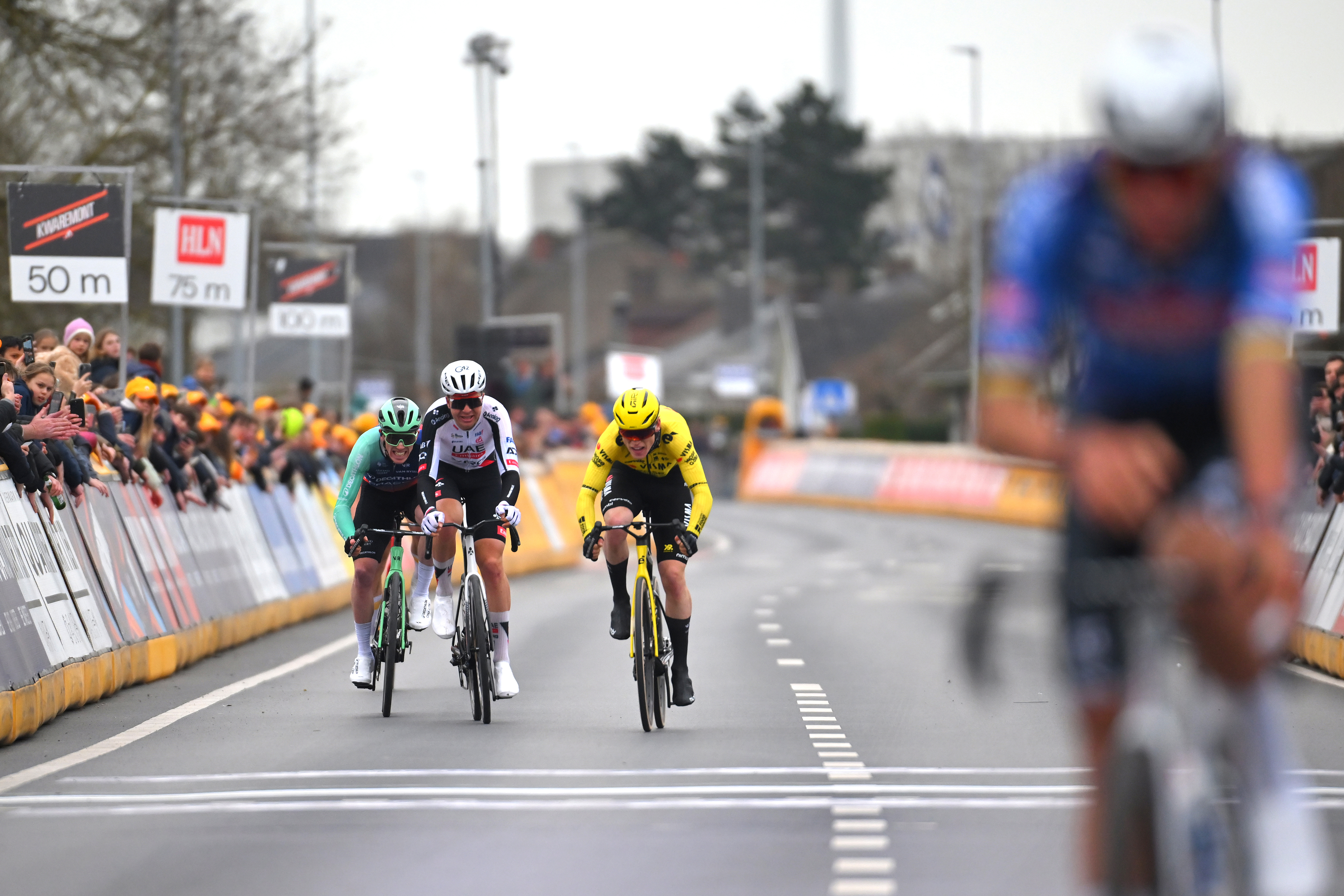 Riders sprint behind an out of focus winner Van der Poel
