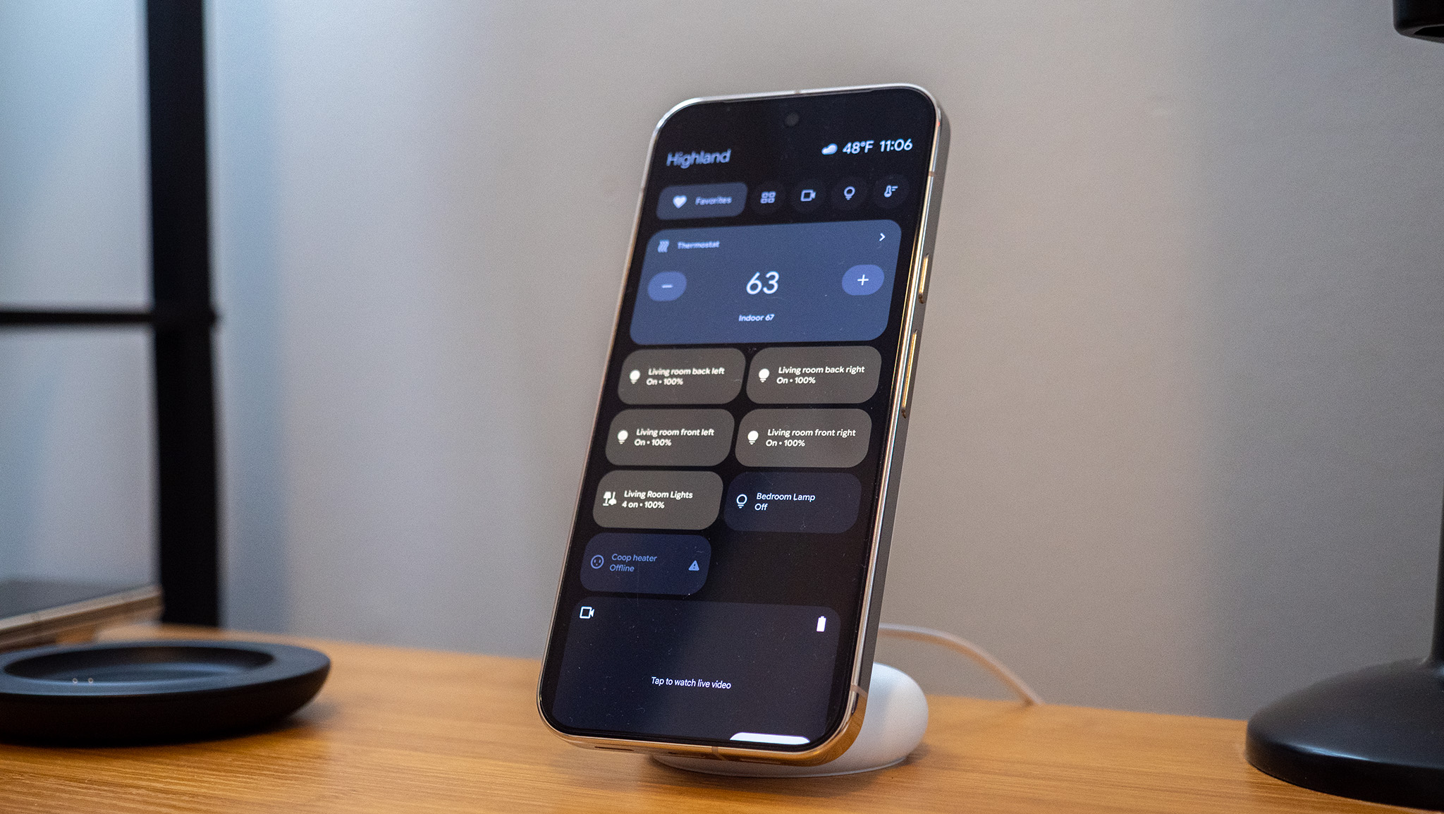 A Google Pixel 10 Pro XL on a Pixelsnap wireless charger with the screensaver function activated