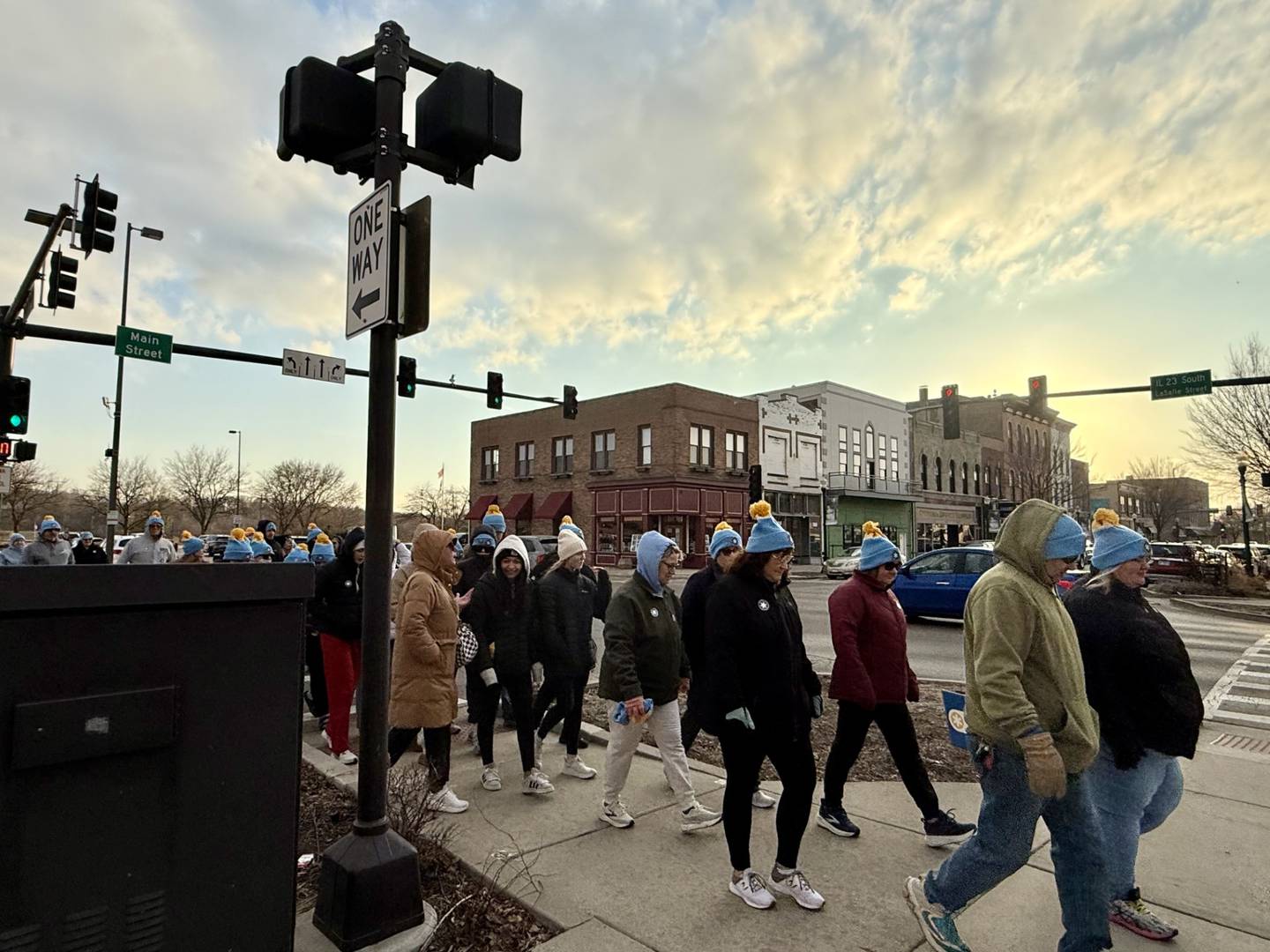 A group of walkers moves along the route during the "Coldest Night of the Year" mile-long walk Saturday night at Jordan Block Park in downtown Ottawa. The event featured more than 110 walkers representing 18 teams.