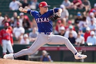 Texas Rangers pitcher Jack Leiter delivers during the first inning of a spring training game...