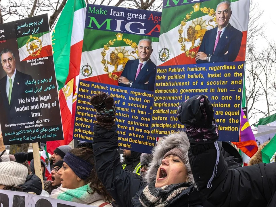  Montrealers protesting in favour of regime change in Iran on Saturday Jan. 31, 2026, hold up images of Reza Pahlavi, son of the former Shah, as their hope for the new leader of the country.