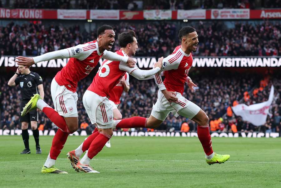 Arsenal's William Saliba celebrates scoring their first goal with Gabriel Magalhaes and Martin Zubimendi