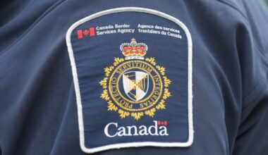 A Canada Border Services Agency patch is seen on the shoulder of a CBSA officer at the Rainbow Bridge border crossing in Niagara Falls, Ont., on Friday, Oct. 17, 2025. THE CANADIAN PRESS/Nathan Denette