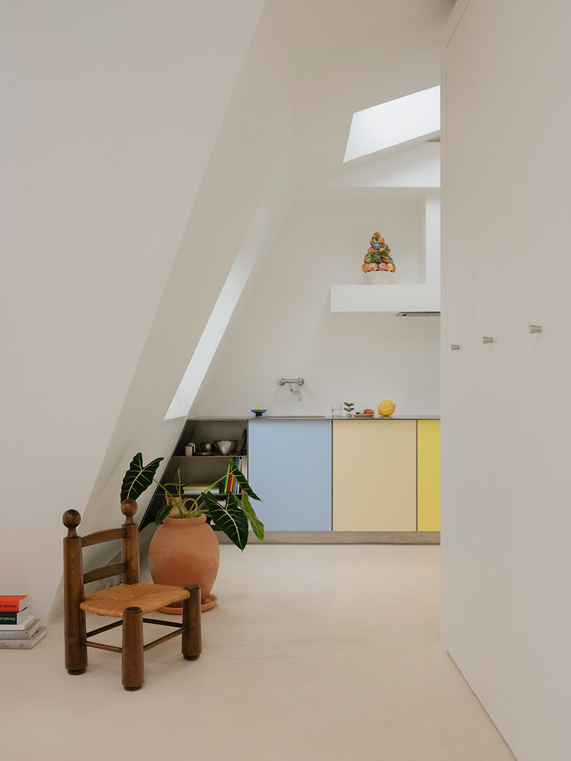 acte deux unifies parisian 'maids' rooms' into 55-square-meter attic apartment - 1