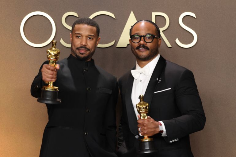 (L/R) US actor Michael B. Jordan holds the Oscar for Best Actor in a Leading Role for "Sinners" and US director Ryan Coogler holds the Oscar for Best Writing (Original Screenplay) for "Sinners" in the press room during the 98th Annual Academy Awards at the Dolby Theatre in Hollywood, California on March 15, 2026. (Photo by VALERIE MACON / AFP)
