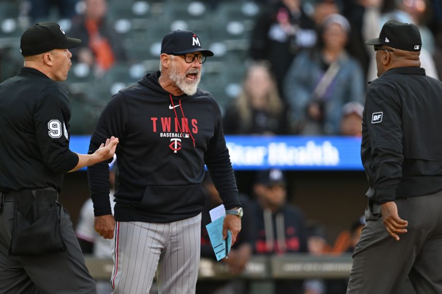 Minnesota Twins manager Derek Shelton argues with umpires Laz Diaz and Chris Segal over a pitch challenge in Baltimore on Sunday. He was ejected from the game.