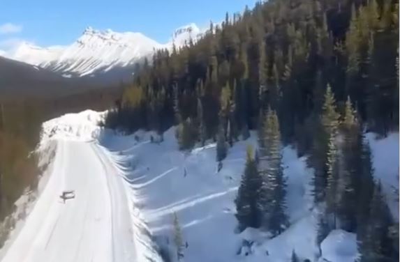 Parks Canada expects the job of clearing the hard packed snow and debris from the Icefields Parkway, will take until March 28 and maybe longer.