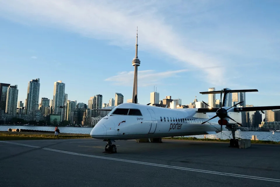 Behind  the scenes at Billy Bishop Toronto City Airport. See parked Porter Airlines planes  and Toronto skyline in bg.