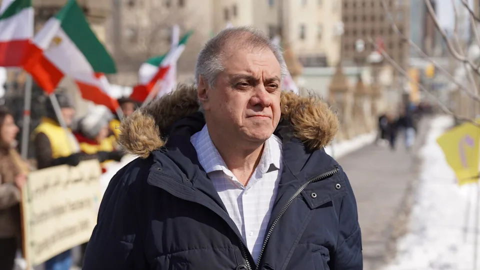 Shahram Golestaneh, director of the Iran Democratic Association in Canada, stands outside parliament on February 28, 2026.