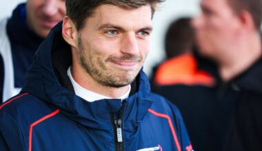 Verstappen smirking in a Verstappen.com jacket during his gt appearance at the Nurburgring