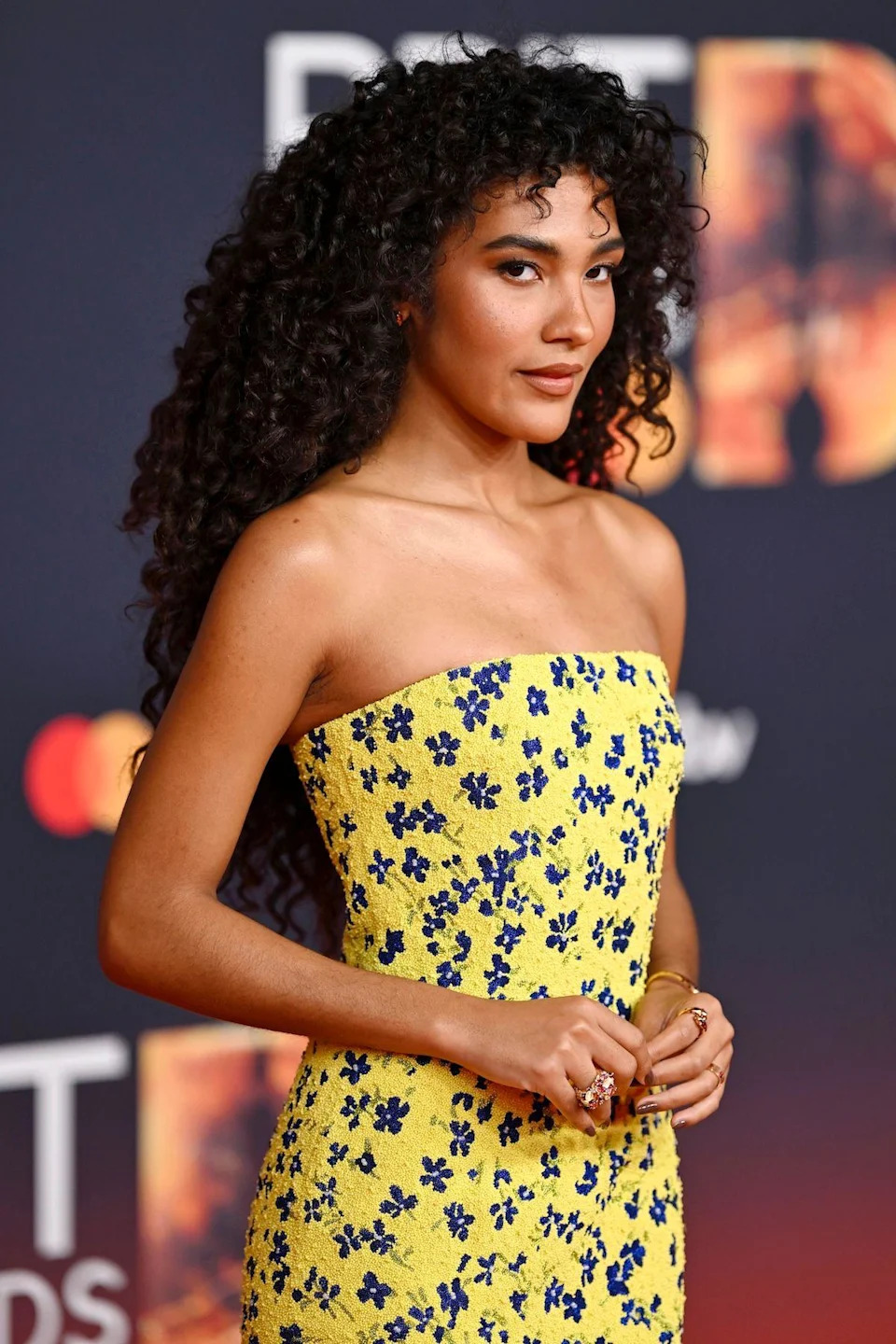 Olivia Dean in a yellow dress