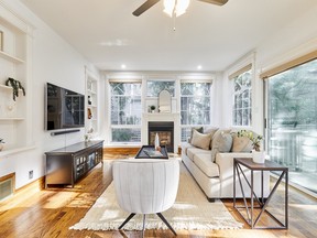 Main-floor features include a sunken living room, an office, a family room addition off the kitchen and a dining area wrapped in glass for a conservatory feel.