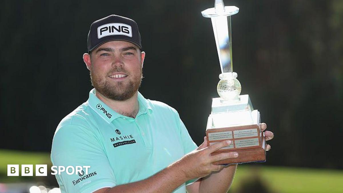 Dan Bradbury holds the Joburg Open trophy after winning the 2026 event