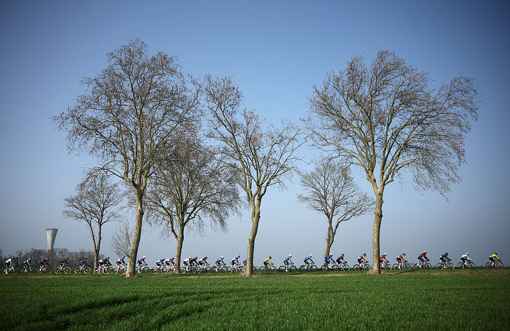 The pack rides during the 1st stage of the Paris-Nice cycling race, 170.9 km between Ach&egrave;res and Carri&egrave;res-sous-Poissy, on March 8, 2026. (Photo by Anne-Christine POUJOULAT / AFP)
