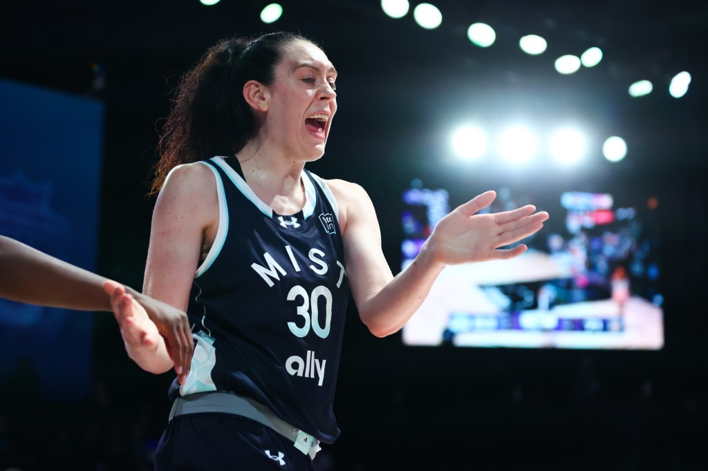 Basketball player Breanna Stewart reacting during a game.