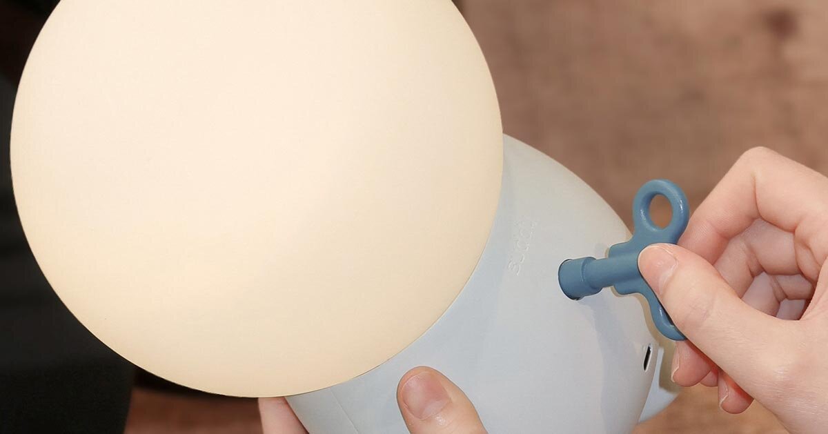 buddy portable mood lamp’s wind-up key encourages interaction