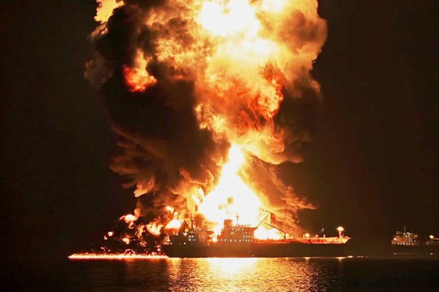 An oil tanker burns after being hit by an Iranian strike in the ship-to-ship transfer zone at Khor al-Zubair port near Basra, Iraq, on March 11.