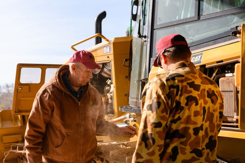 “I haven’t gotten all my strength back, but I’ve got a son here working with me, and I’m working again. I’ve been blessed with everything,” says Henard, here with son Colby.