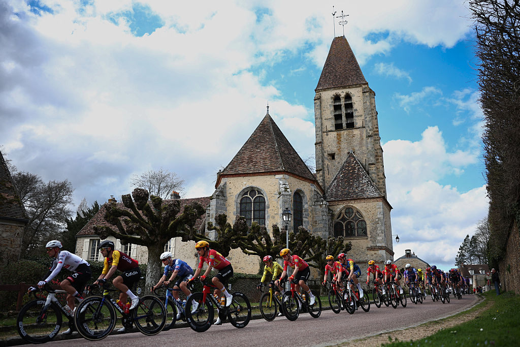 The pack rides during the 2nd stage of the Paris-Nice cycling race, 187 km between &Eacute;p&ocirc;ne and Montargis, on March 9, 2026. (Photo by Anne-Christine POUJOULAT / AFP)