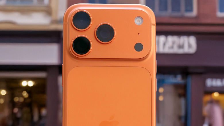 A Cosmic Orange iPhone 17 Pro or Pro Max with its back facing the camera