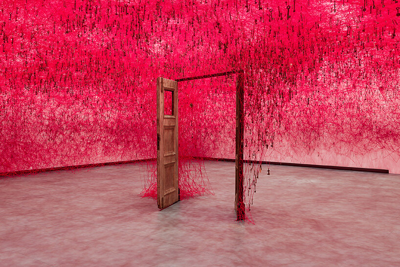 chiharu shiota's woven webs meet yin xiuzhen's clothing installations at hayward gallery - 4