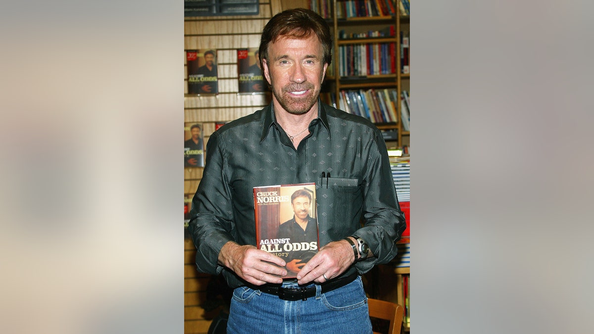 Chuck Norris promoting his book "Against All Odds."