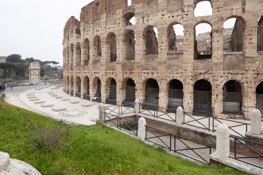 Travertine piazza alongside Colosseum