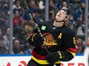 A frustrated Brock Boeser reacts to missing the net against the Calgary Flames in a listless 5-2 loss on Sunday night.
