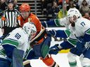 Vancouver Canucks goaltender Nikita Tolopilo bobbles the puck against the Ducks on Nov. 26 in Anaheim.
