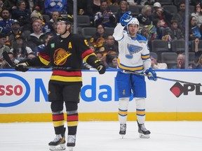 St. Louis Blues' Pavel Buchnevich celebrates his goal as Vancouver Canucks' Brock Boeser looks on