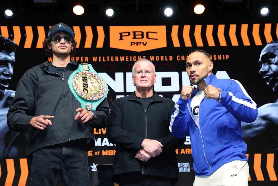LOS ANGELES, CALIFORNIA - FEBRUARY 4: Sebastian Fundora, left, the WBC Super Welterweight World Champion, and  Keith Thurman, right, face off with promoter Tom Brown standing in between them after a news conference at AVALON Hollywood on February 4, 2026 in Los Angeles, California. The bout will take place at the MGM Grand Garden Arena in Las Vegas, Nevada, on Saturday, March 28, 2026. (Photo by Kevork Djansezian/Getty Images)