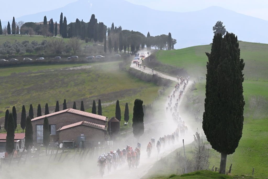 SIENA, ITALY - MARCH 08: A general view of the peloton passing through a landscape during the 19th Strade Bianche 2025, Men&amp;apos;s Elite a 213km one day race from Siena to Siena 320m / #UCIWT / on March 08, 2025 in Siena, Italy. (Photo by Tim de Waele/Getty Images)