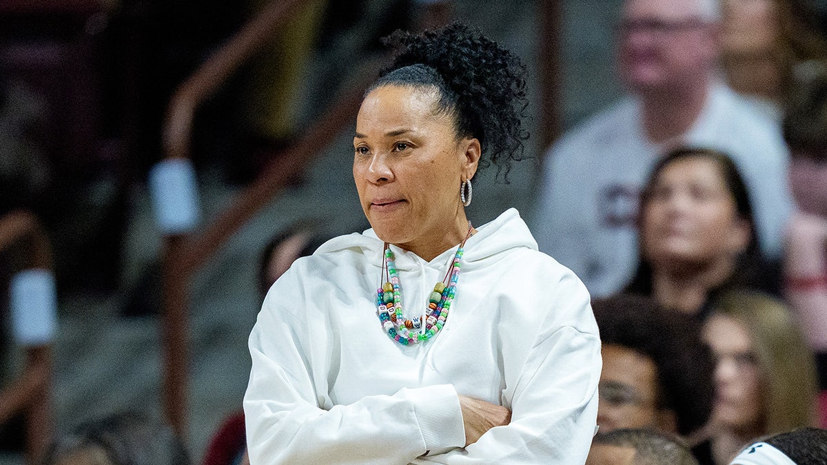 Dawn Staley looks on