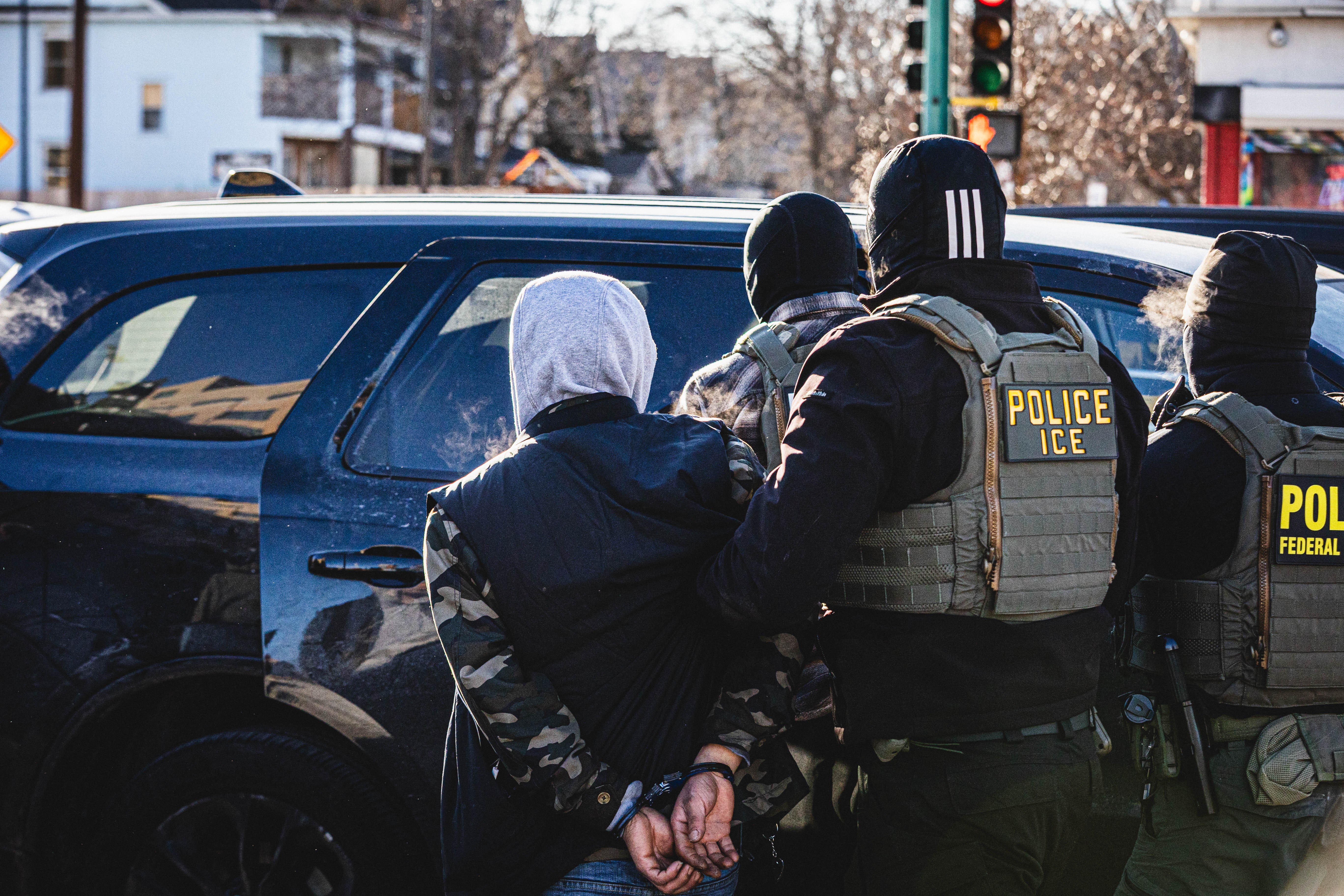 ICE agents detain a man in Minneapolis, Minnesota on Jan. 14, 2026.