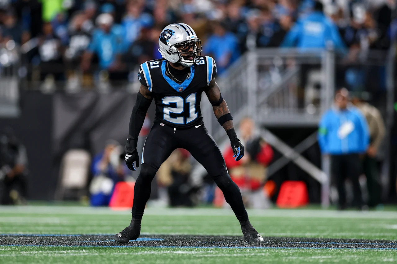CHARLOTTE, NORTH CAROLINA - JANUARY 10: Nick Scott #21 of the Carolina Panthers defends in pass coverage during an NFL wild card playoff football game against the Los Angeles Rams at Bank of America Stadium on January 10, 2026 in Charlotte, North Carolina. (Photo by Kevin Sabitus/Getty Images)