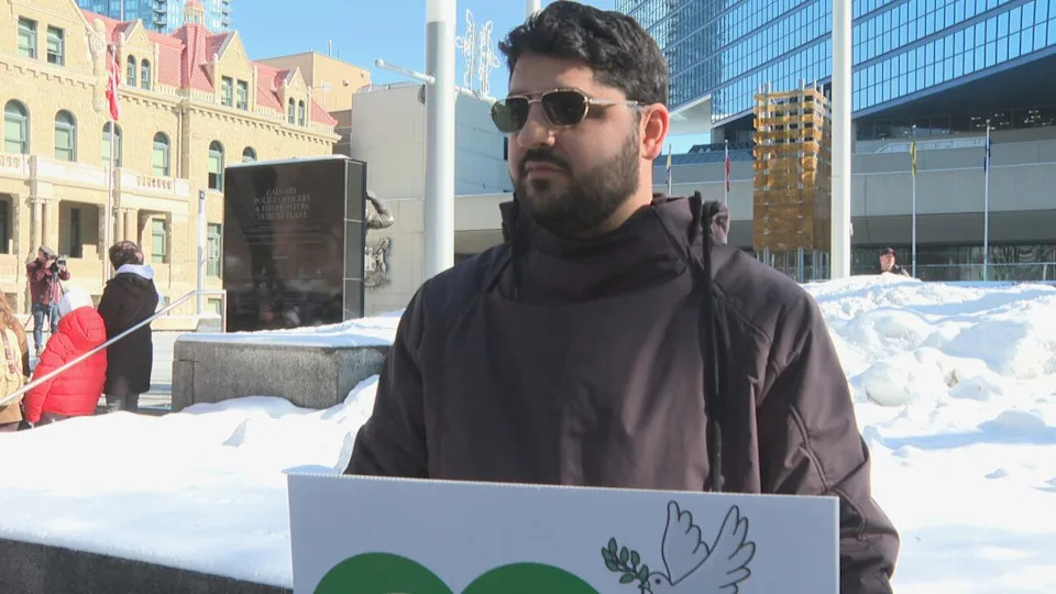 Mohammad Alamatsaz, a rallygoer who immigrated from Iran as a child, was among more than 150 Calgarians who gathered at city hall to mourn the death of Iran's Supreme Leader Ayatollah Ali Khamenei, who was killed by U.S.-Israeli strikes the day before.