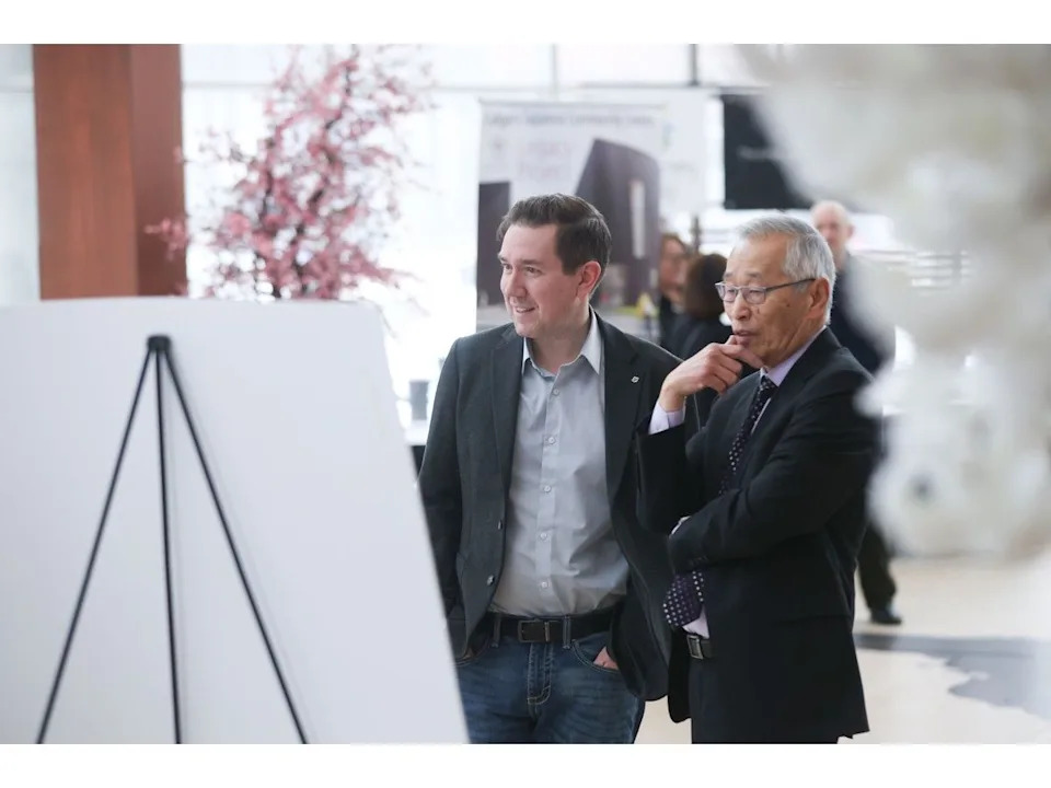  Corey Hogan, Calgary MP and Parliamentary Secretary to the Minister of Energy and Natural Resources, speaks with Roger Teshima, past president of the Calgary Japanese Community Association and co-chair for its Legacy Building Project, on Saturday.