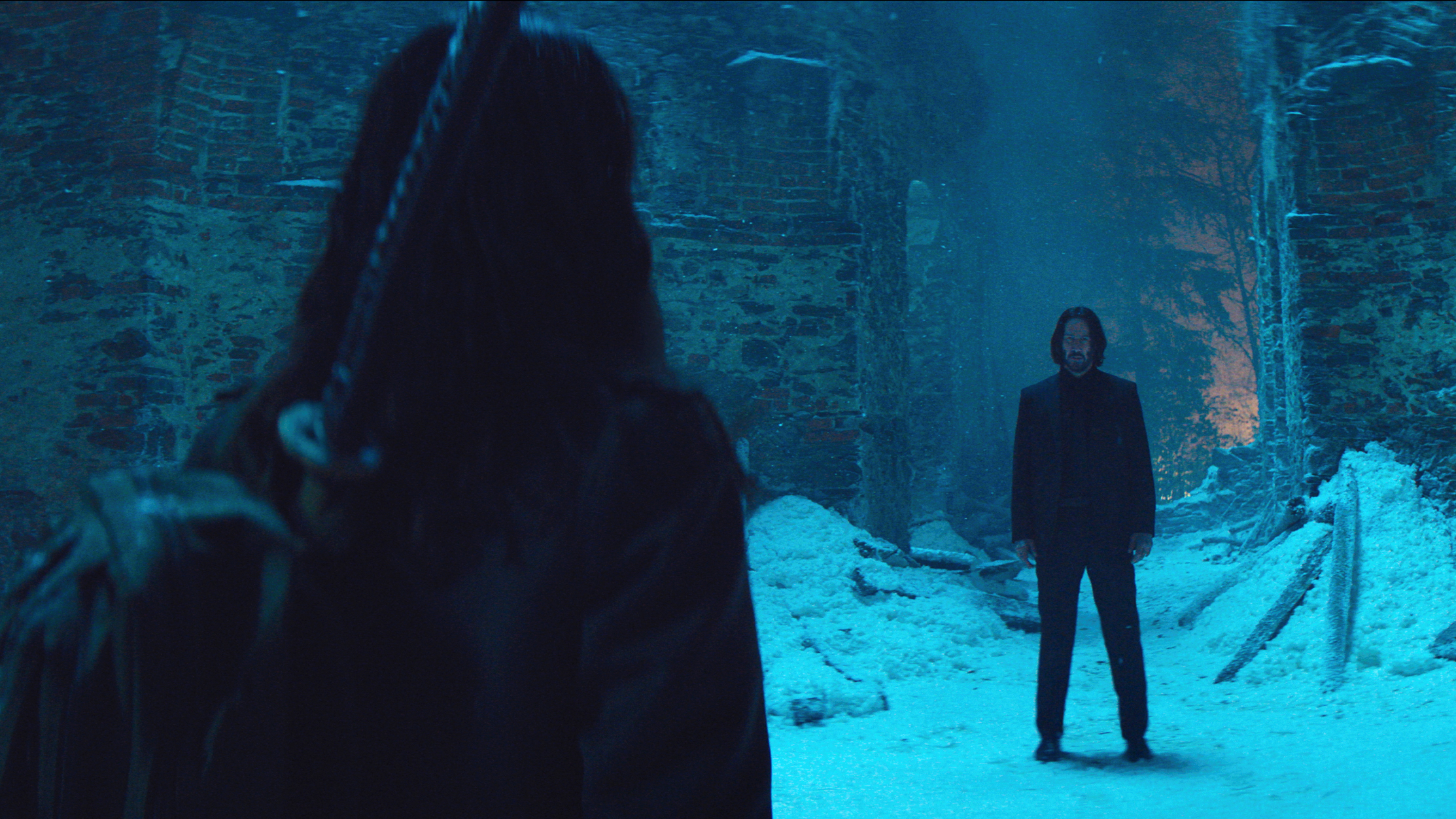 Eve (Ana de Armas) and John Wick (Keanu Reeves) face off in a still from "Ballerina"