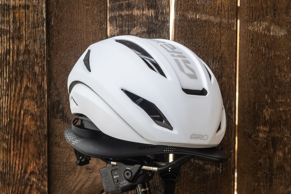 Bicycle helmet resting on a wooden surface.