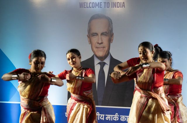 Dancers perform as Canadian Prime Minister Mark Carney arrives in New Delhi, India on Sunday, March 1, 2026. THE CANADIAN PRESS/Adrian Wyld