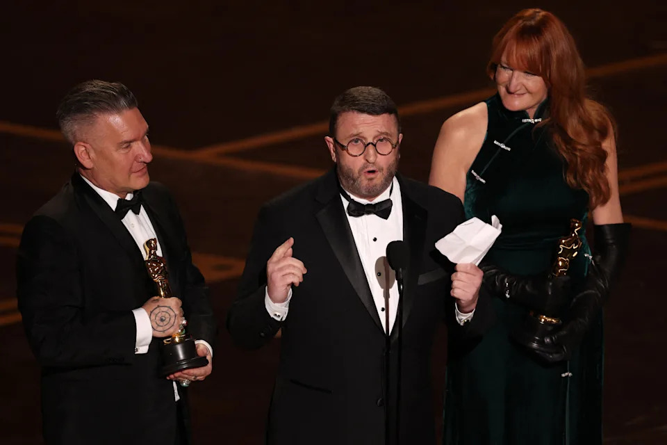 Hair and make-up artists (L/R) Jordan Samuel, Mike Hill and Cliona Furey speak onstage after winning the Oscar for Best Makeup and Hairstyling for 