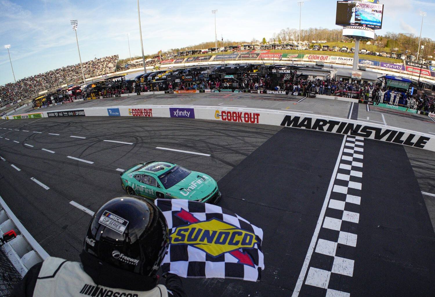 Chase Elliott, driver of the #9 UniFirst Chevrolet, takes the checkered flag to win the NASCAR Cup Series Cook Out 400 at Martinsville Speedway on March 29, 2026 in Martinsville, Virginia. (Photo by Jacob Kupferman/Getty Images)