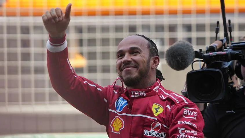 Lewis Hamilton gives a thumbs up to the crowd after winning the China sprint race