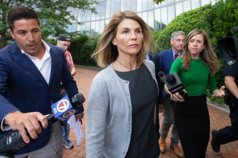 Lori Loughlin walks past reporters as she exits the John Joseph Moakley United States Courthouse in Boston on August 27, 2019. On March 12, 2019, she and dozens of others were charged in a college admissions scheme. File Photo by Matthew Healey/UPI